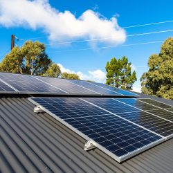 Solar panels on Australian house roof New solar panels installed on metal sheet roof of the house in South Australia